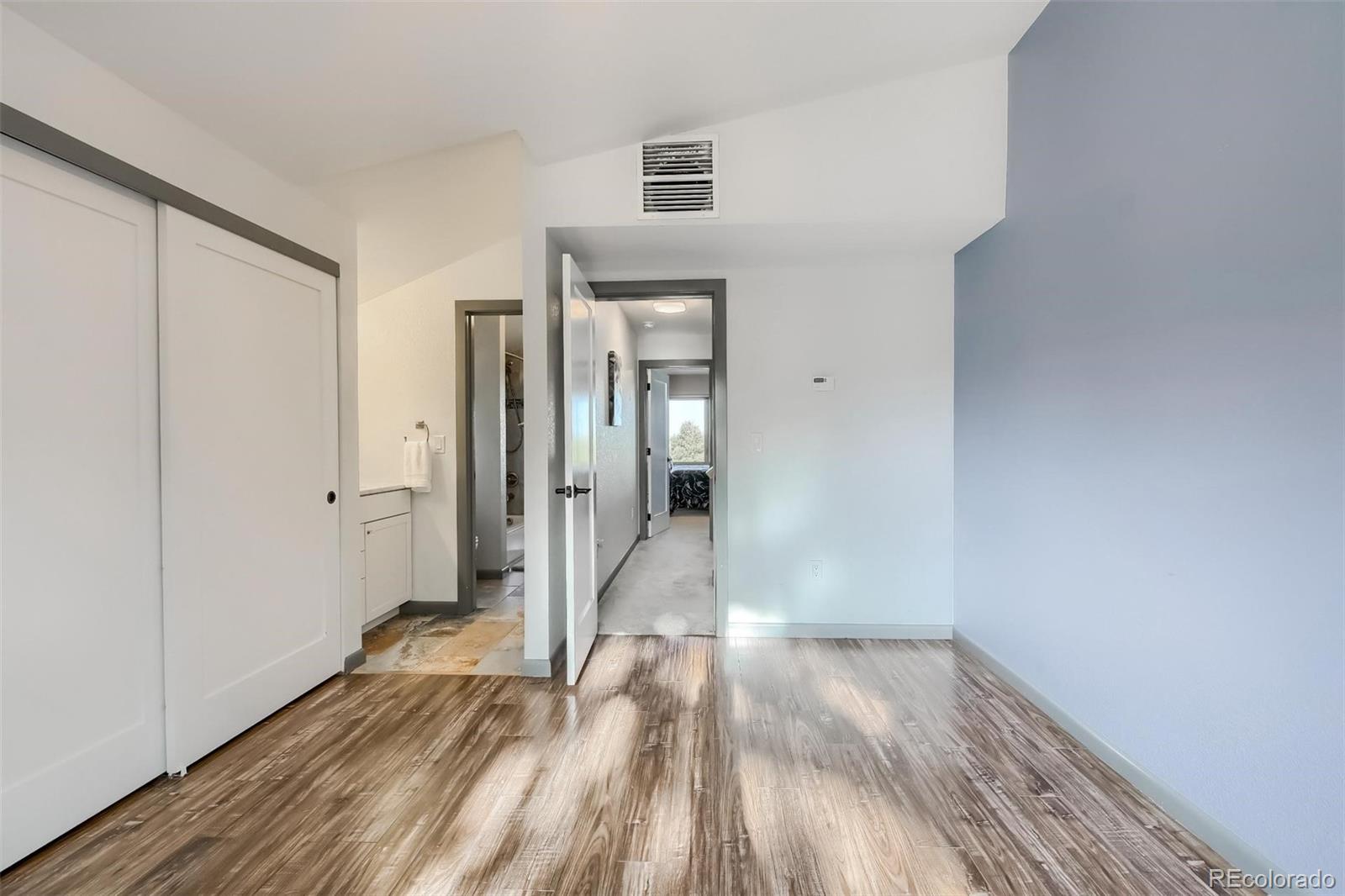 1320 Chambers Drive Boulder, CO 80305 - Photo 25 of 39 a view of a room with wooden floor and a hallway