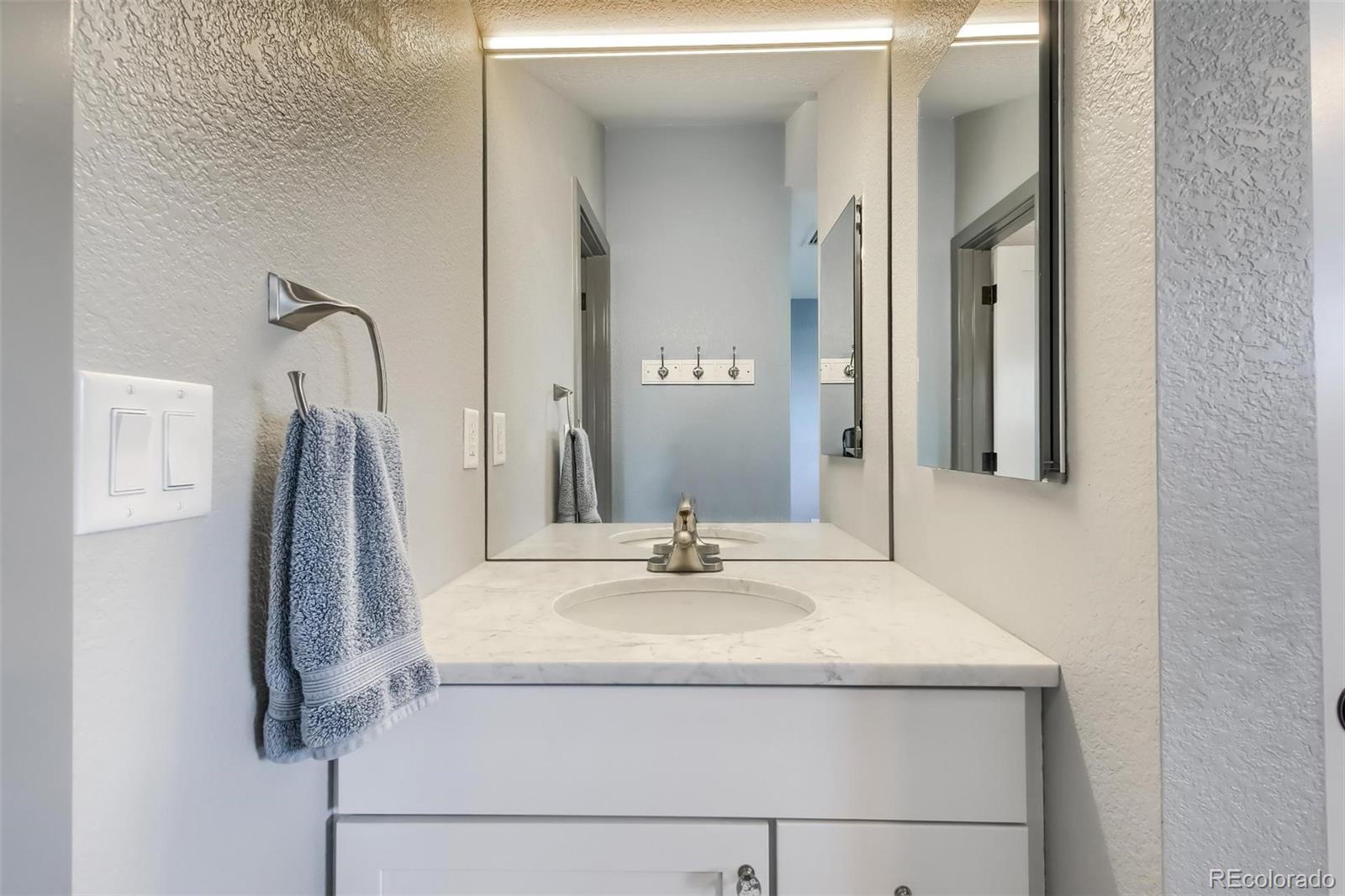1320 Chambers Drive Boulder, CO 80305 - Photo 27 of 39 a bathroom with a sink and a mirror