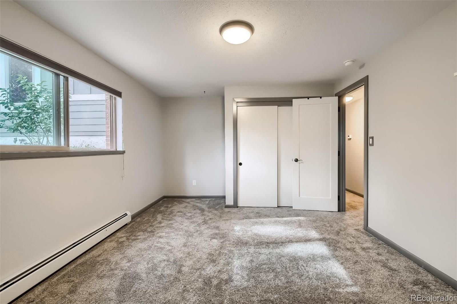 1320 Chambers Drive Boulder, CO 80305 - Photo 31 of 39 an empty room with a empty space and windows