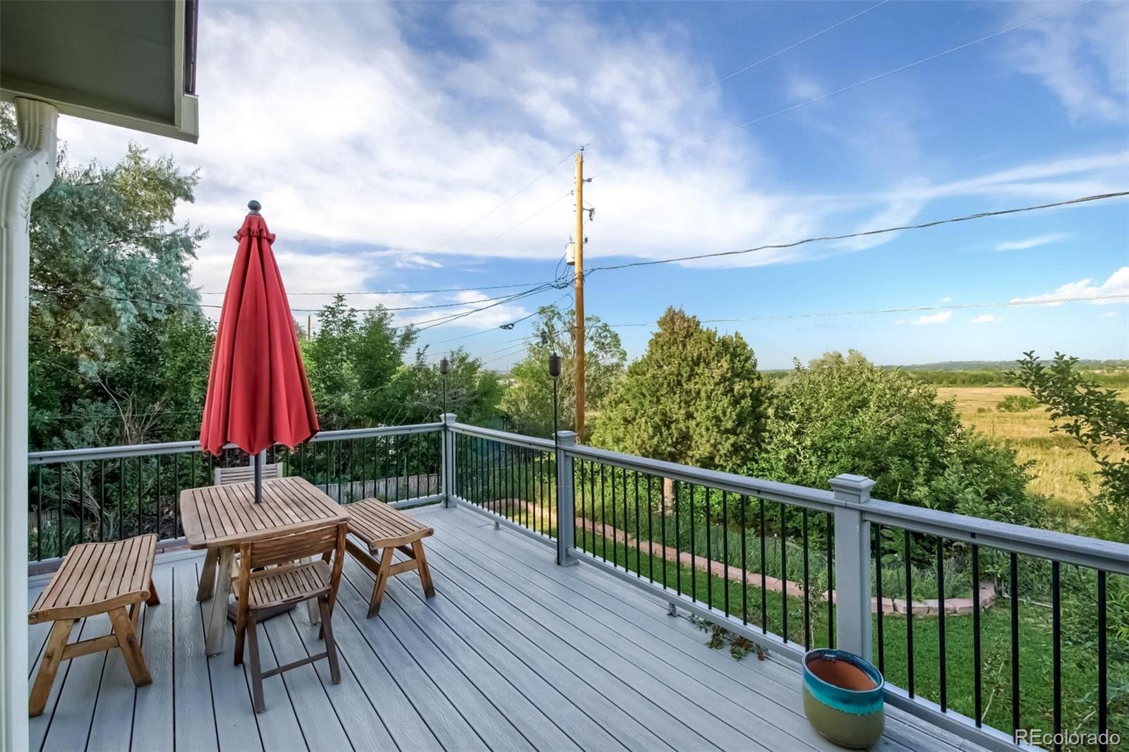 1320 Chambers Drive Boulder, CO 80305 - Photo 36 of 39 a view of a balcony with wooden floor and outdoor seating