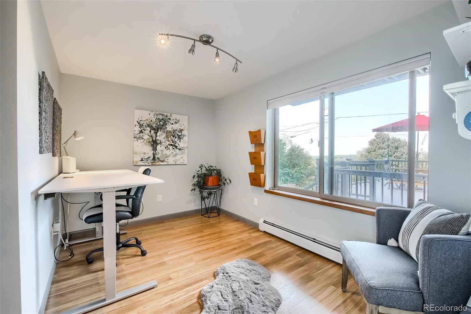 1320 Chambers Drive Boulder, CO 80305 - Photo 9 of 39 a living room with furniture and a window