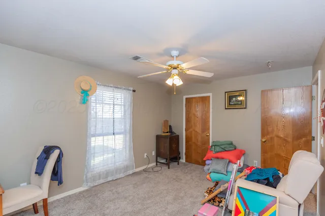 a view of a livingroom with furniture and window