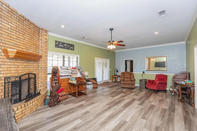 a living room with furniture and a fireplace