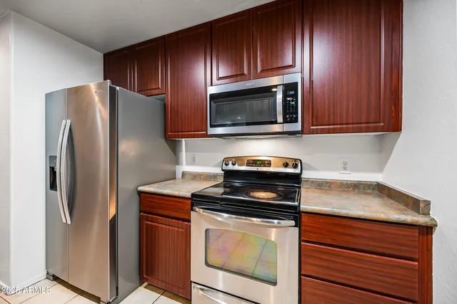 a sink with granite countertop a sink and cabinets