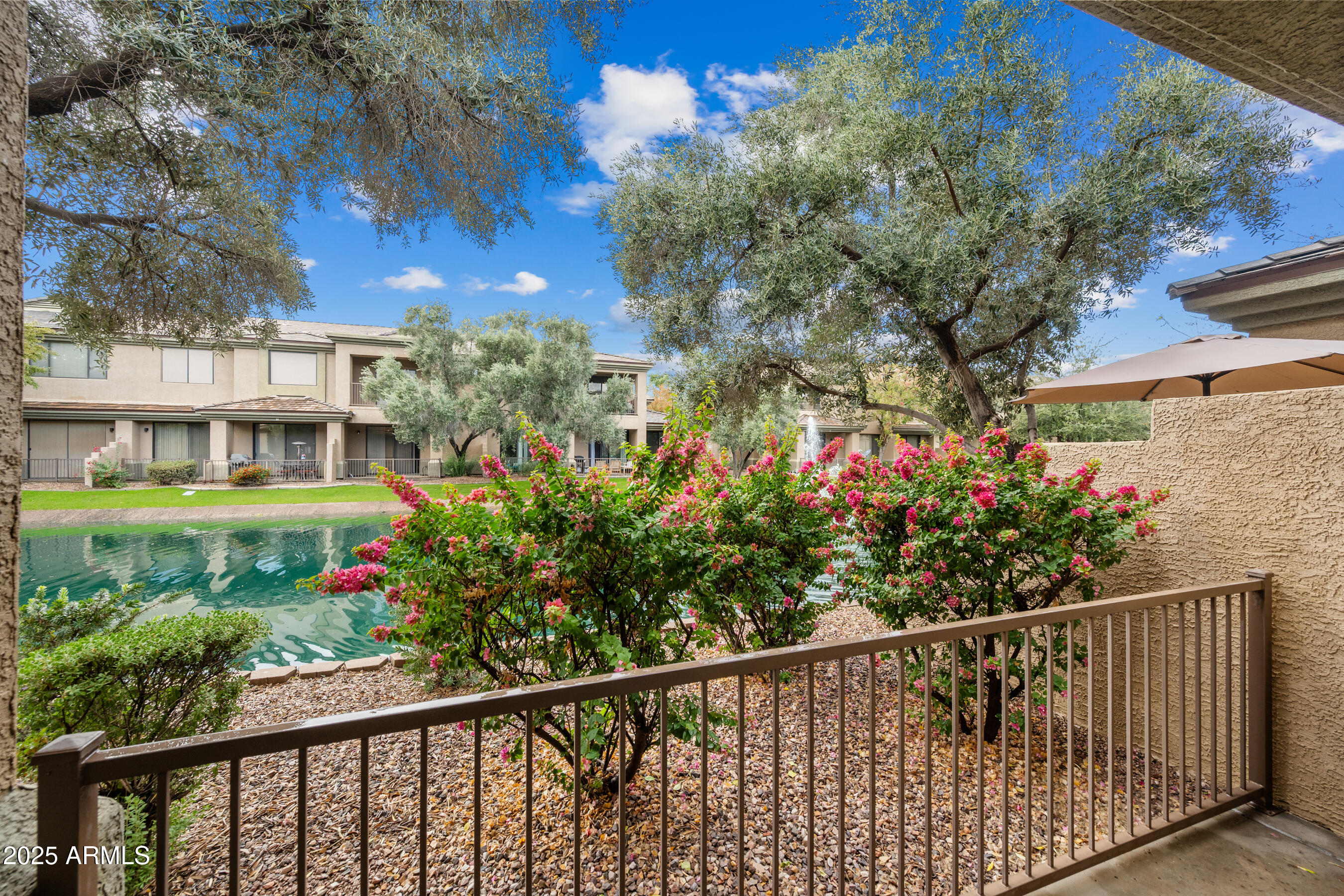 705 West Queen Creek Road, Unit 1079 Chandler, AZ 85248 - Photo 18 of 28 a view of a house with a flower garden