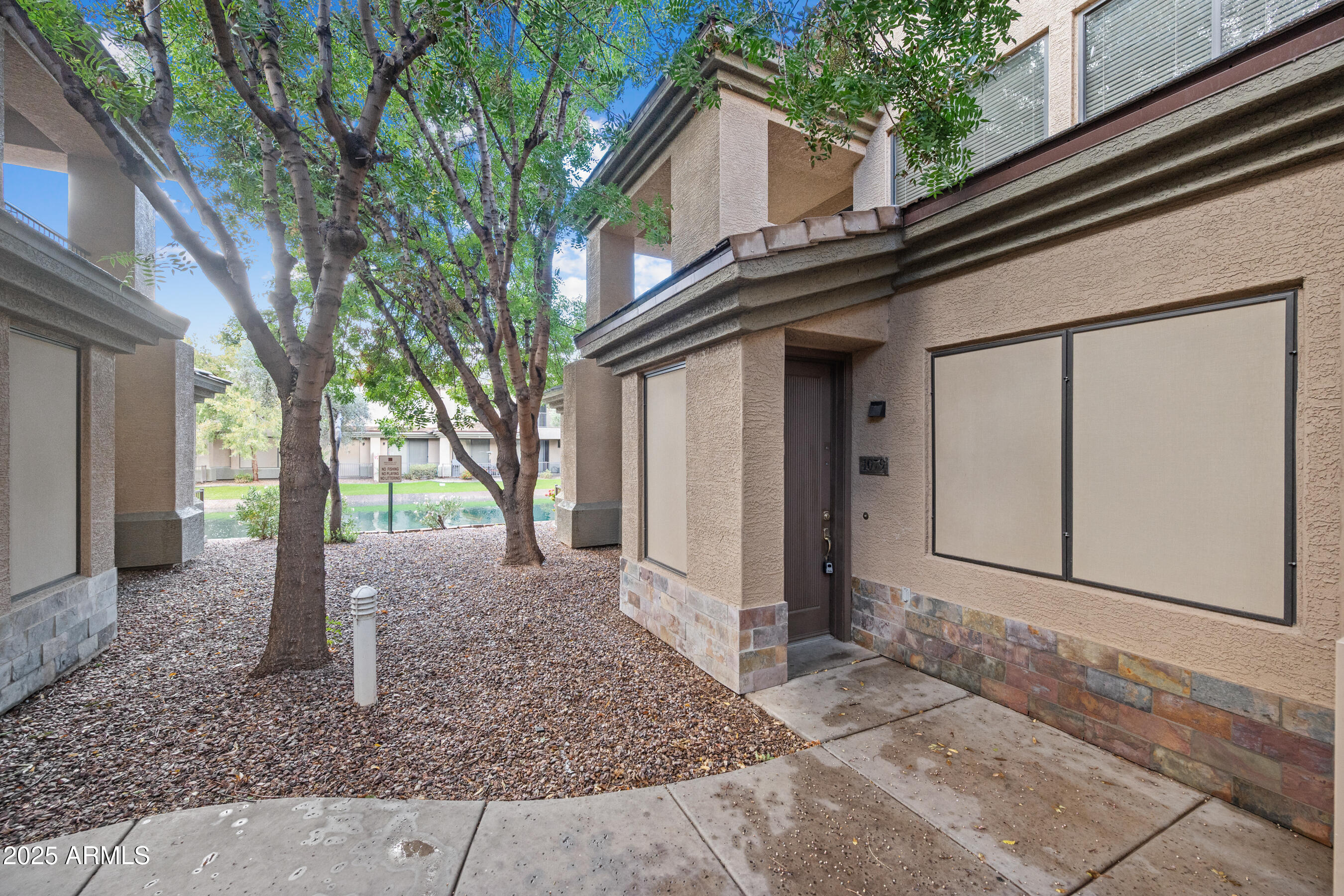 705 West Queen Creek Road, Unit 1079 Chandler, AZ 85248 - Photo 2 of 28 a house view with a backyard space