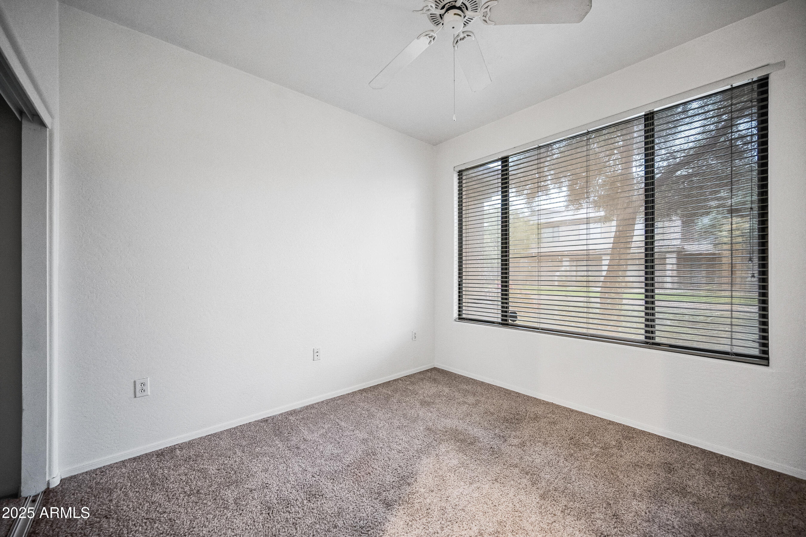 705 West Queen Creek Road, Unit 1079 Chandler, AZ 85248 - Photo 24 of 28 a view of an empty room with a window