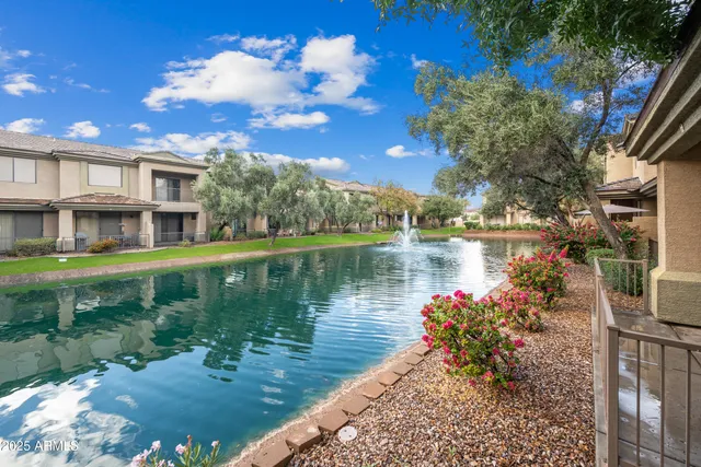 a view of a lake with a house in the background