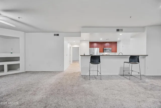 a view of kitchen with furniture and window
