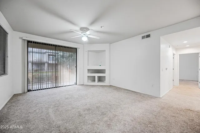 a view of an empty room with a window