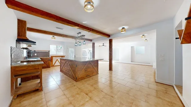 a large living room with stainless steel appliances granite countertop lots of counter top space