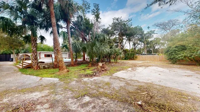 a view of a house with a snow in the yard