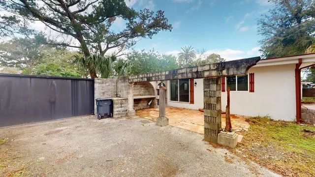 a view of a house with snow on the road