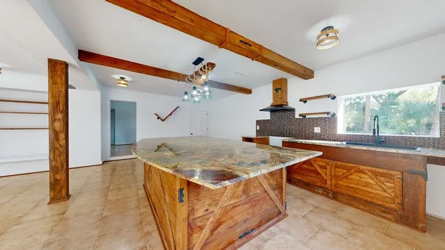 a very nice looking living room with a large window