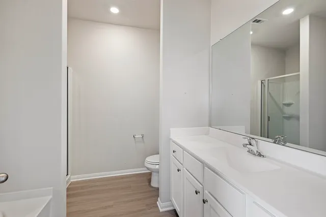 a bathroom with a glass shower door
