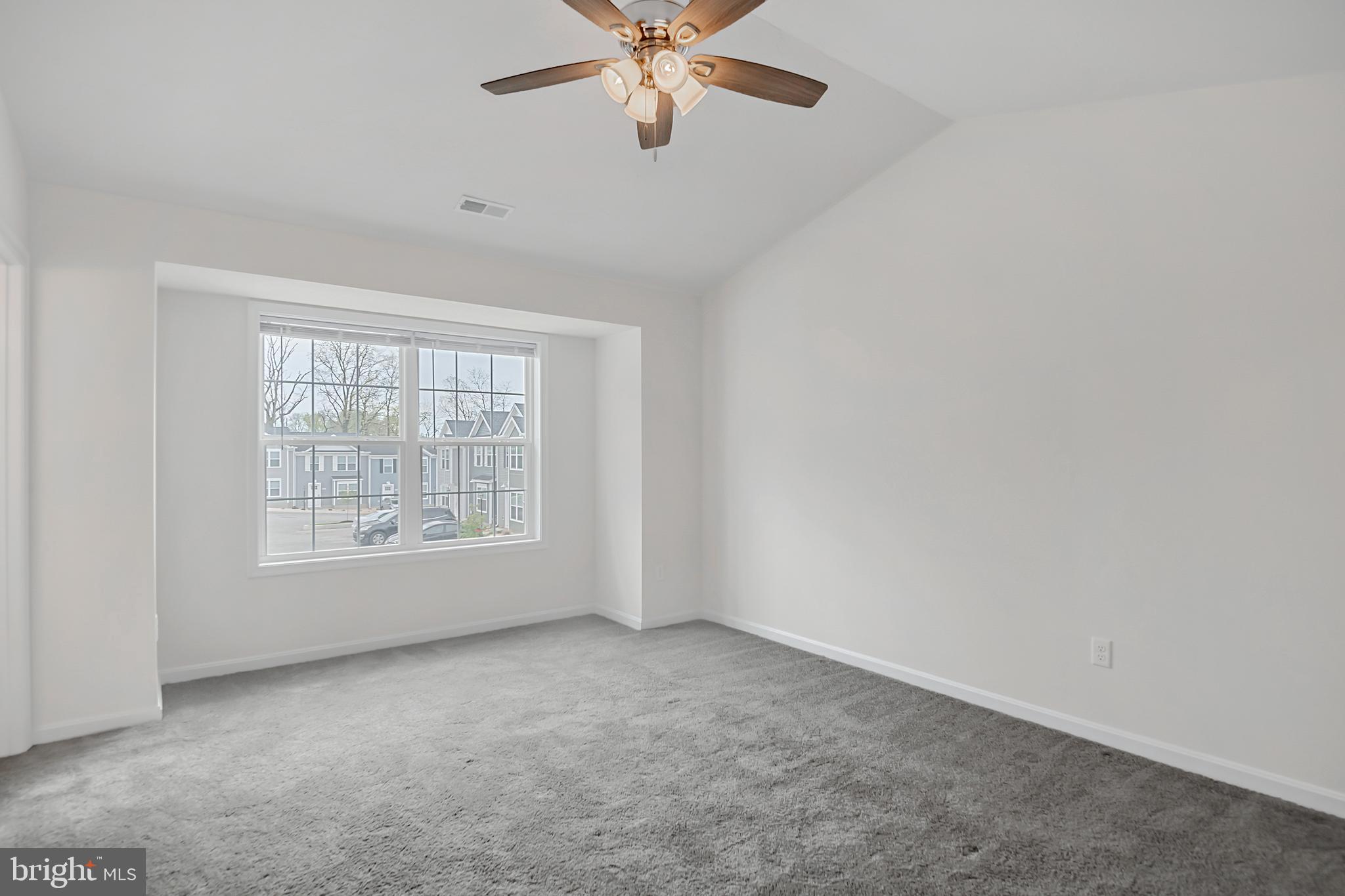 403 Valor Way Red Lion, PA 17356 - Photo 12 of 22 an empty room with a window and a fan