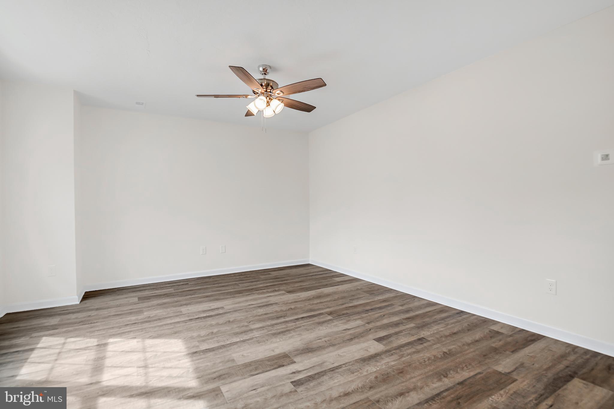 403 Valor Way Red Lion, PA 17356 - Photo 4 of 22 a view of empty room with wooden floor and fan