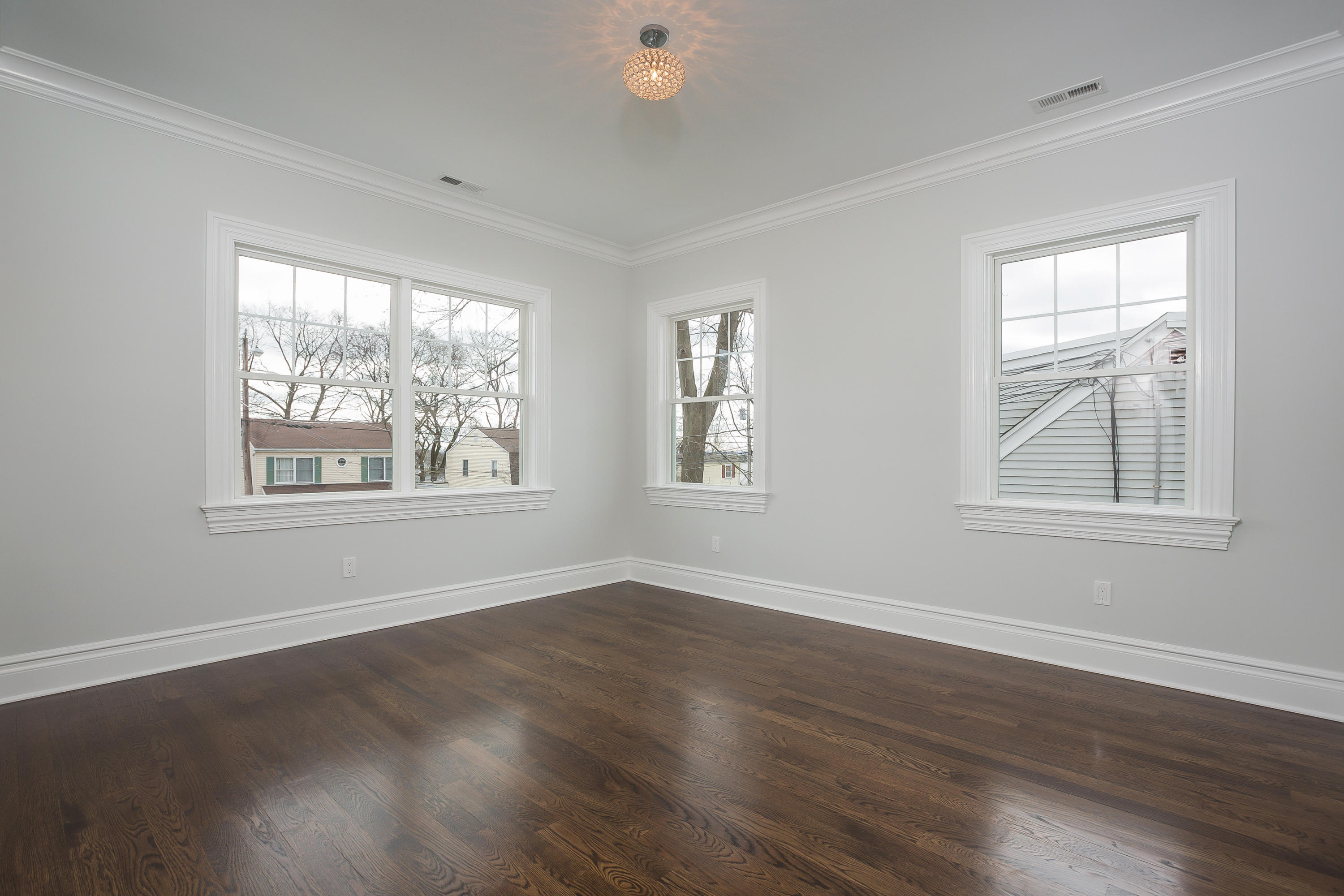 30 Albin Road Stamford, CT 06902 - Photo 27 of 38 a view of an empty room with wooden floor and a window