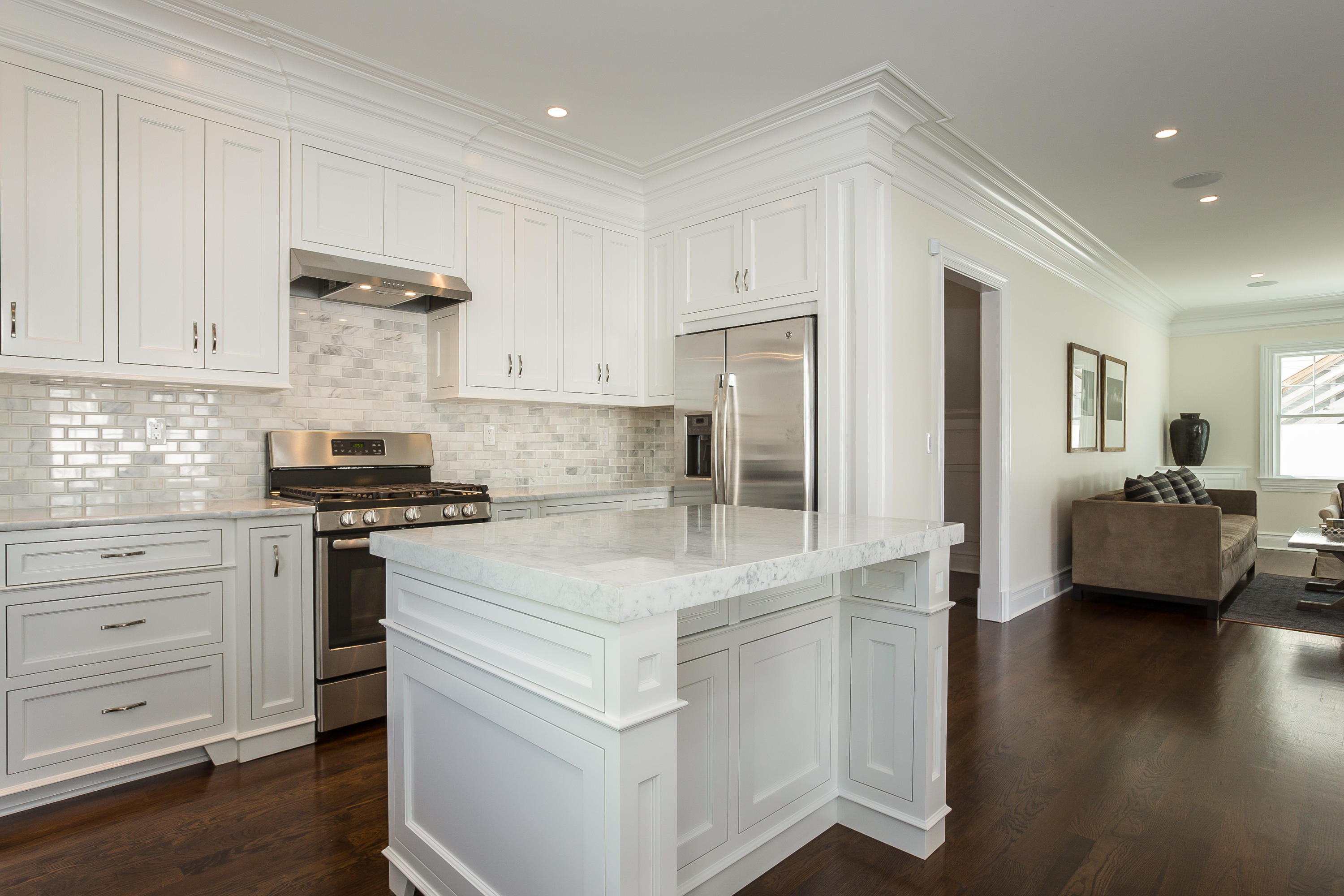 30 Albin Road Stamford, CT 06902 - Photo 10 of 38 a kitchen with kitchen island white cabinets and stainless steel appliances