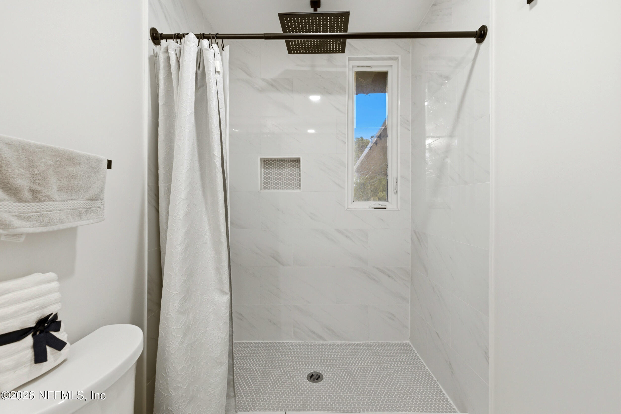 7484 Spinola Road Jacksonville, FL 32217 - Photo 33 of 63 a bathroom with a shower