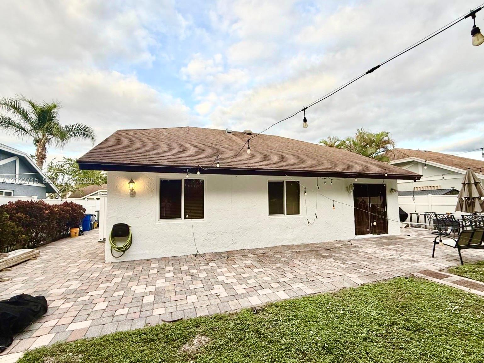 10669 Boca Entrada Boulevard Boca Raton, FL 33428 - Photo 18 of 19 a view of a house with backyard and trees