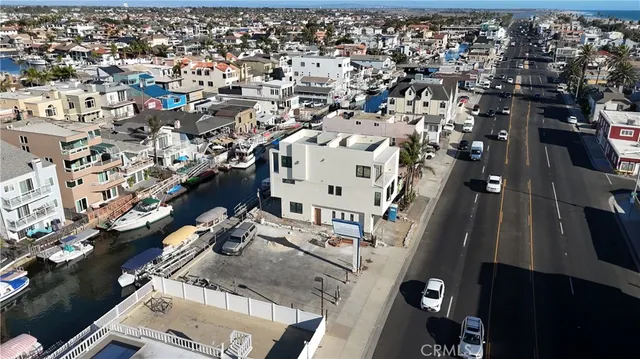 an aerial view of a residential apartment building with a yard