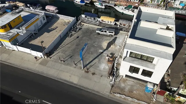 an aerial view of a residential apartment building with a street