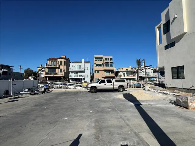 a view of the terrace along with cars parked