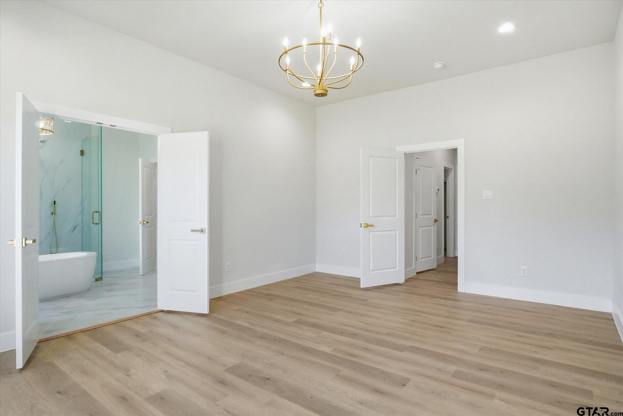 340 Dalton Road Canton, TX 75103 - Photo 17 of 31 a view of an empty room with wooden floor and a window
