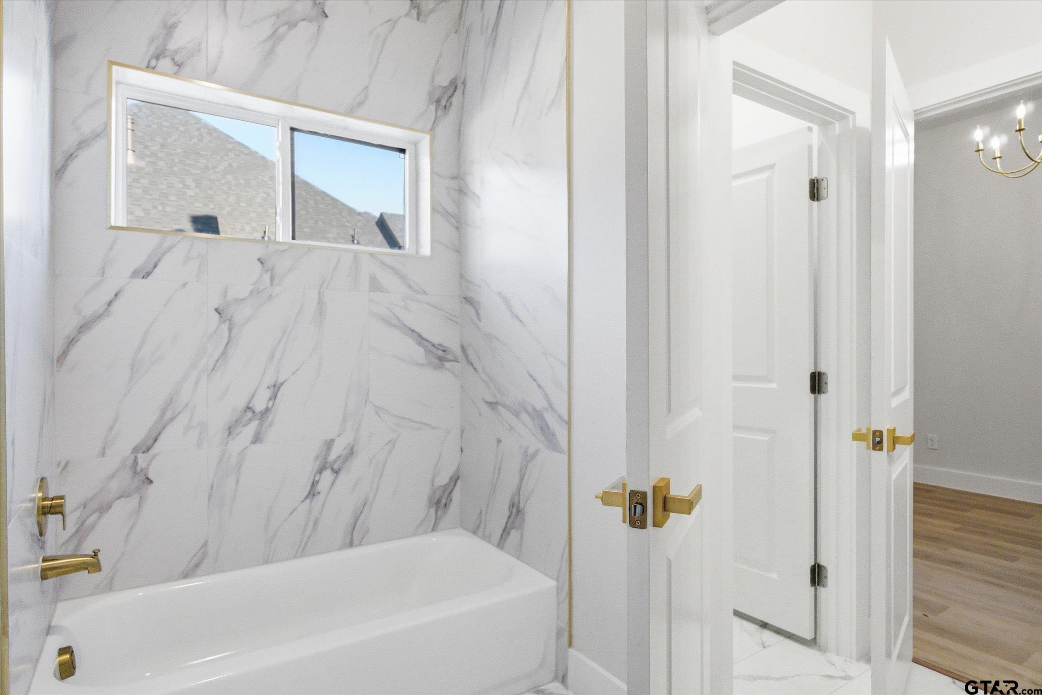 340 Dalton Road Canton, TX 75103 - Photo 24 of 31 a bathroom with a bathtub and shower