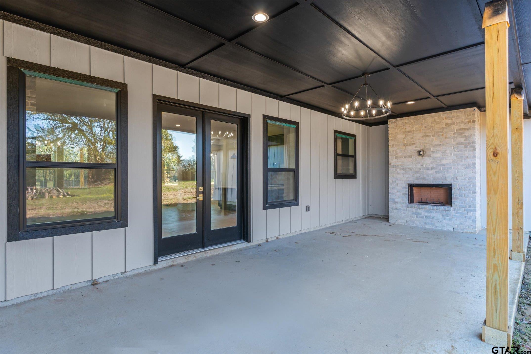 340 Dalton Road Canton, TX 75103 - Photo 28 of 31 a view of an empty room with a fireplace and a window