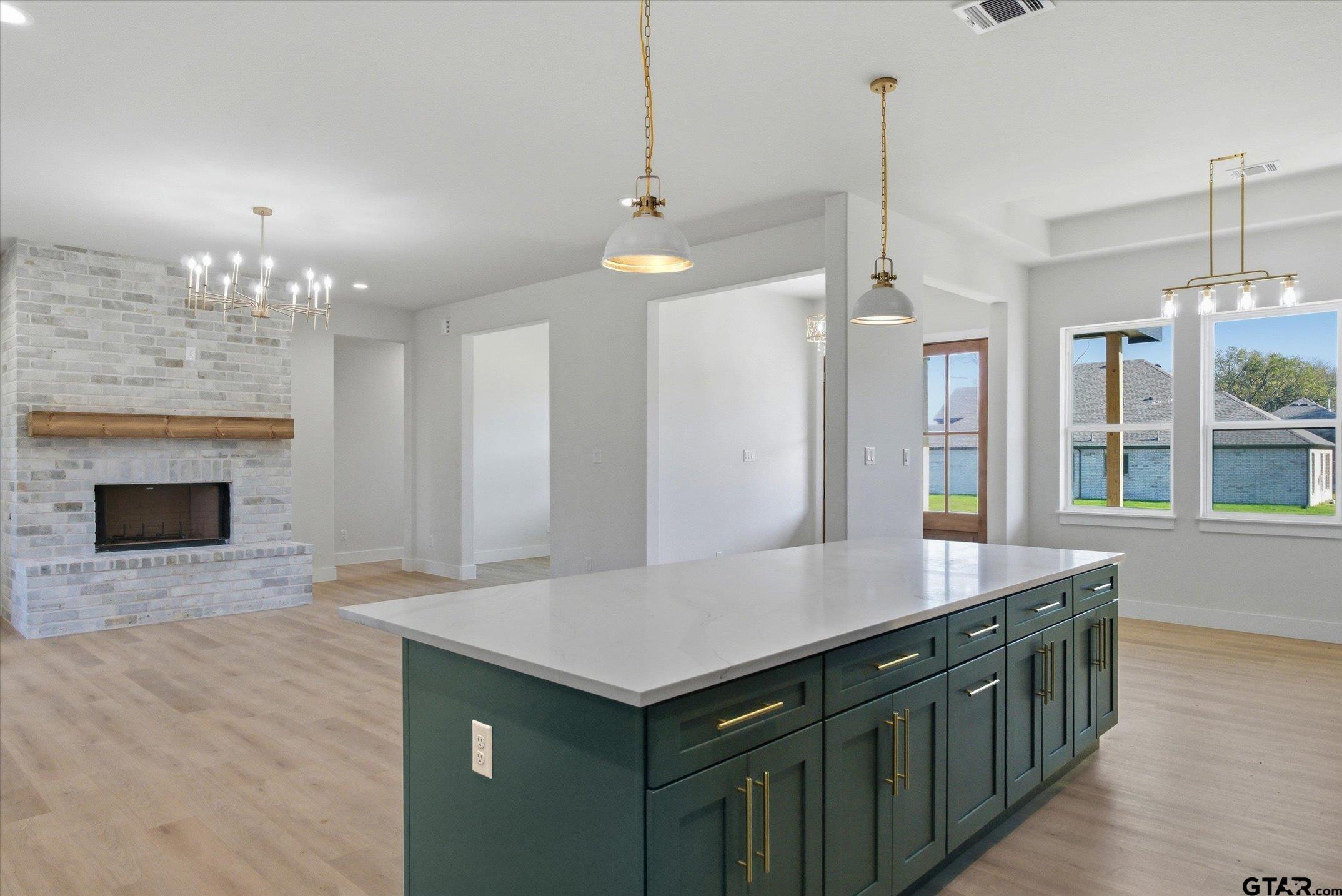 340 Dalton Road Canton, TX 75103 - Photo 10 of 31 a kitchen with a sink and a fireplace