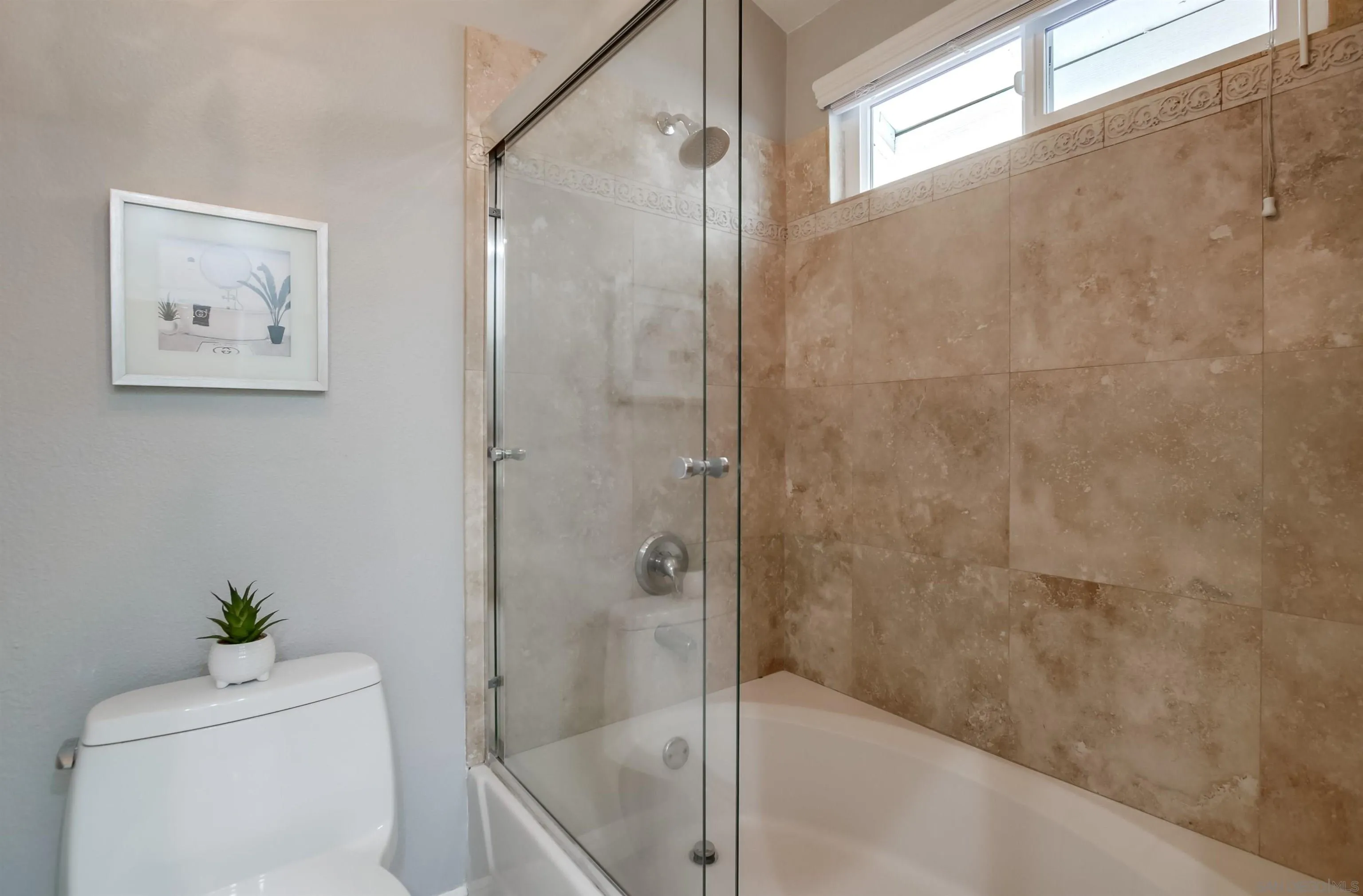 14150 Carmel Ridge Road San Diego, CA 92128 - Photo 13 of 21 a bathroom with a shower and a toilet