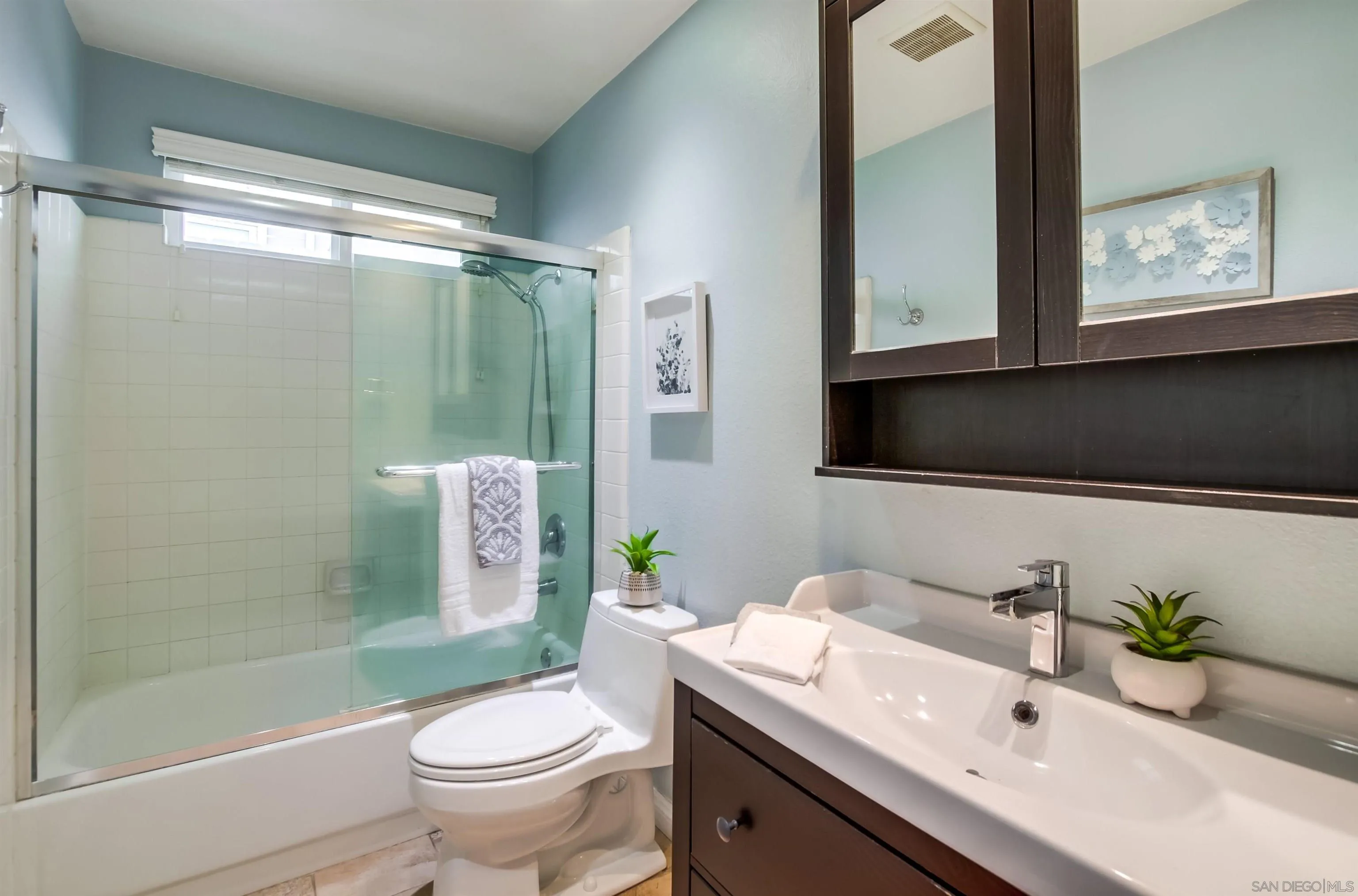 14150 Carmel Ridge Road San Diego, CA 92128 - Photo 16 of 21 a bathroom with a granite countertop sink toilet and shower