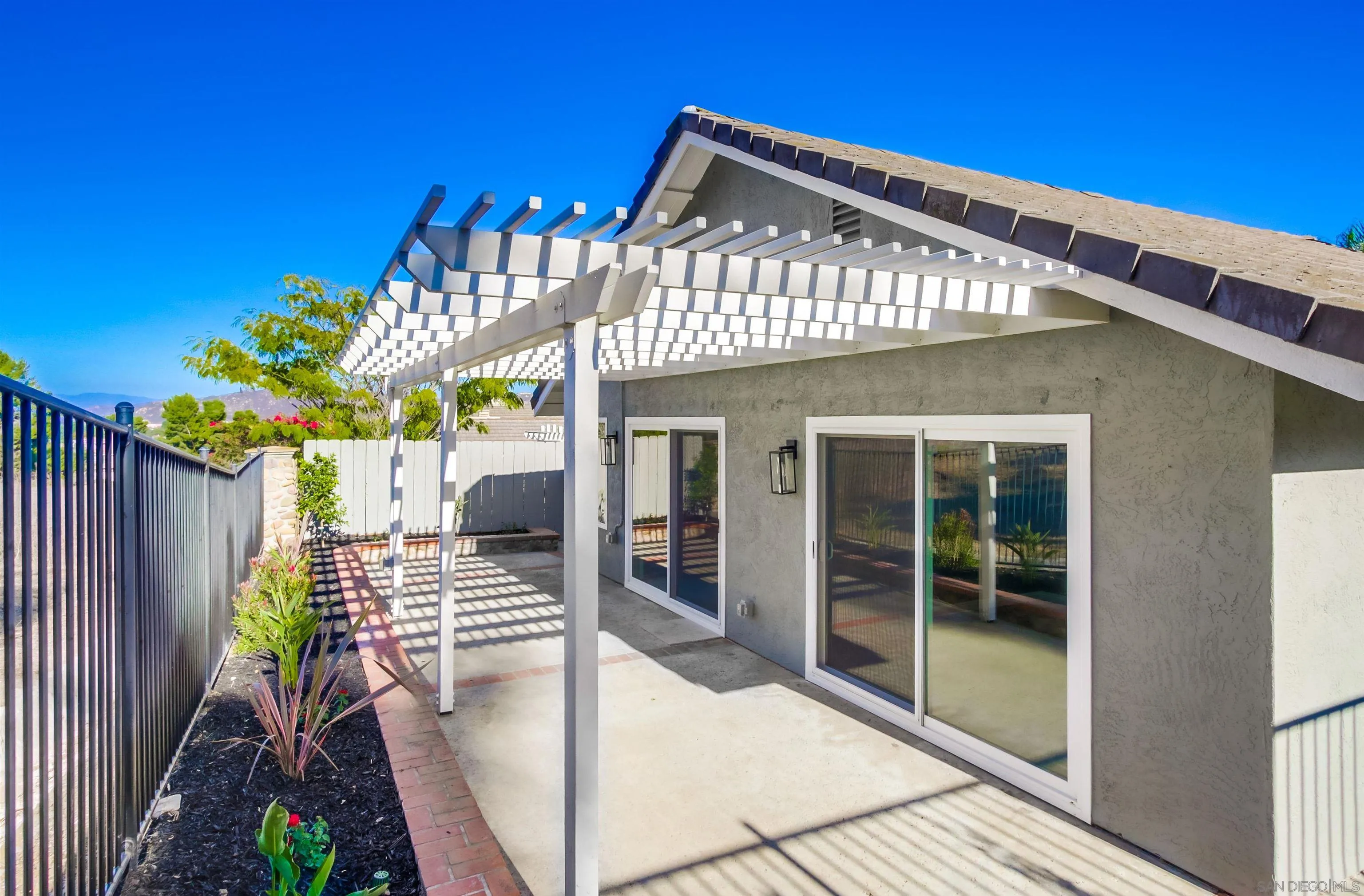 14150 Carmel Ridge Road San Diego, CA 92128 - Photo 19 of 21 a front view of a house with a porch
