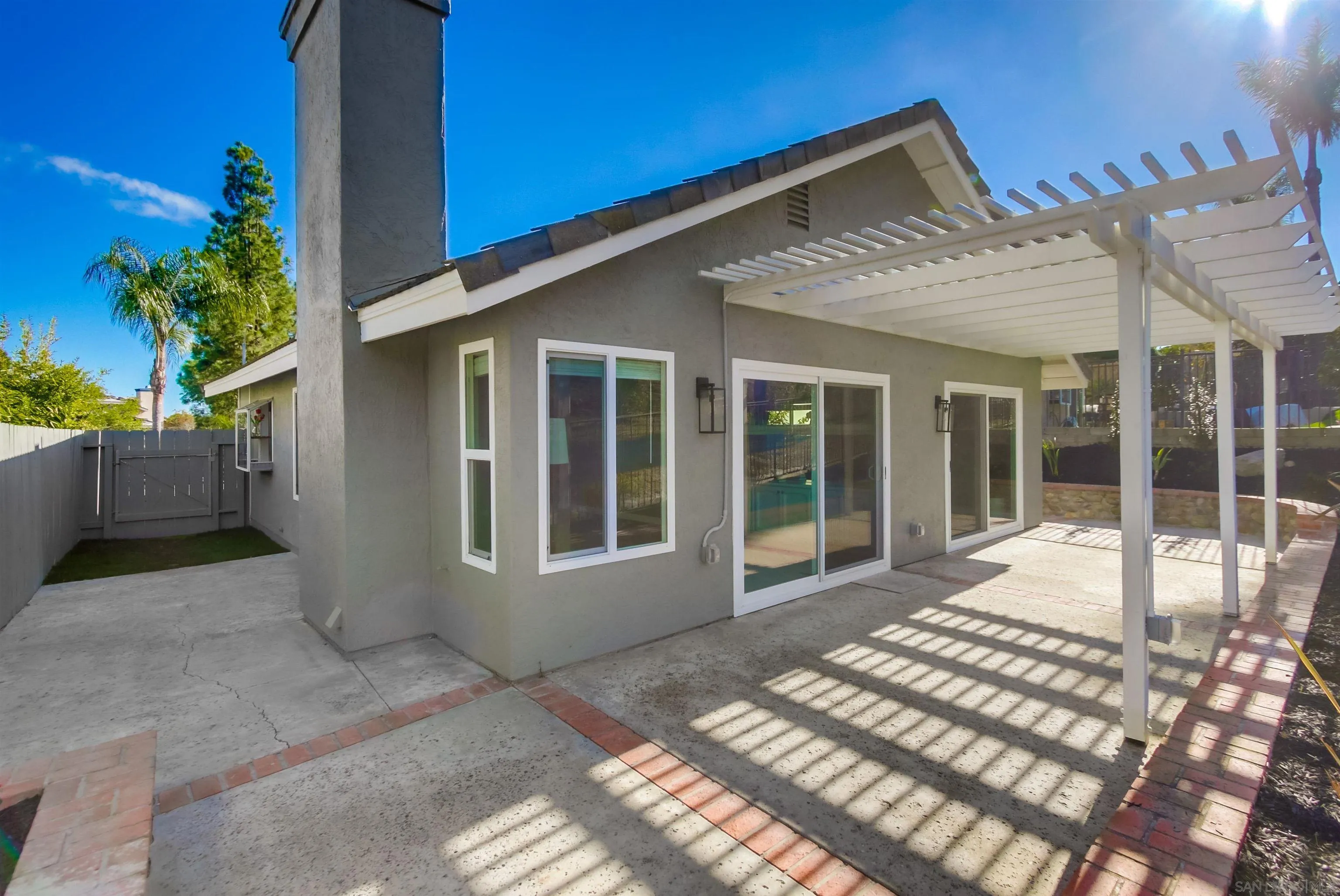 14150 Carmel Ridge Road San Diego, CA 92128 - Photo 20 of 21 a view of a house with backyard porch and sitting area