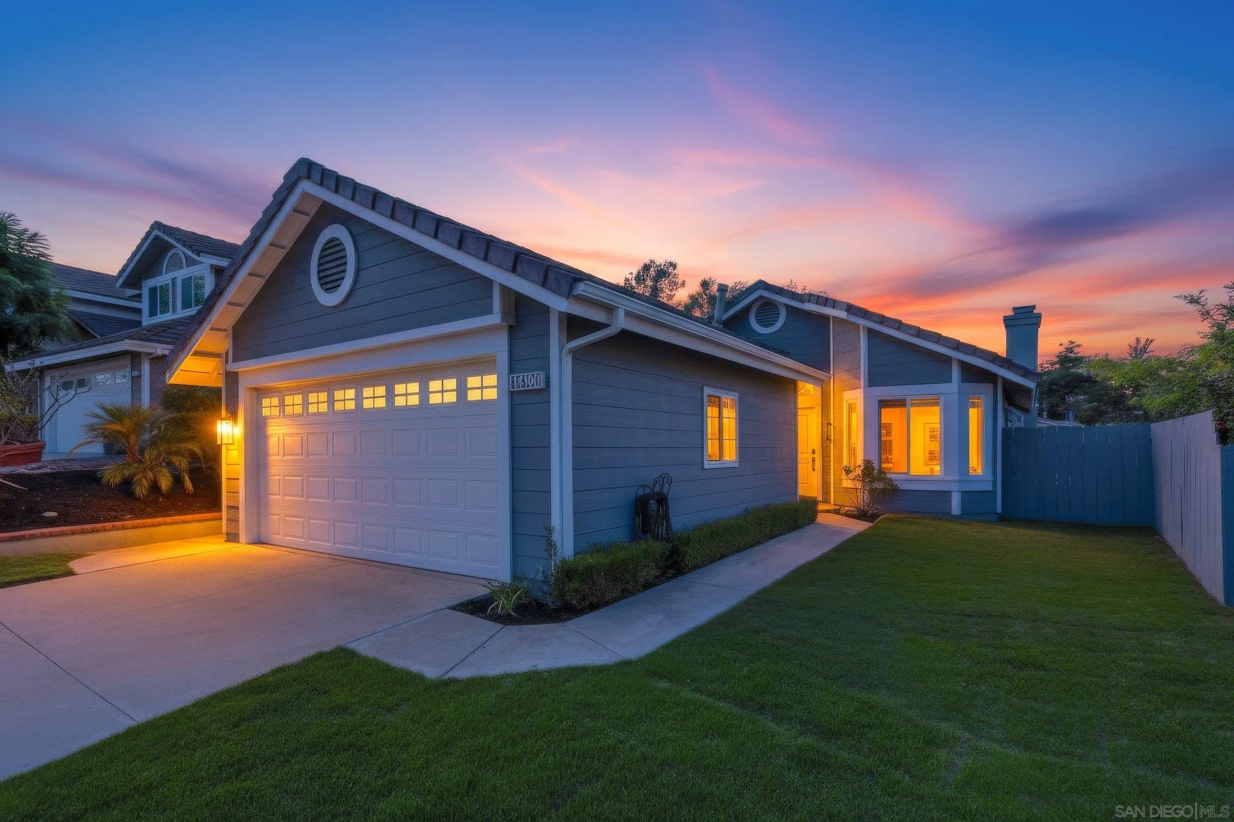 14150 Carmel Ridge Road San Diego, CA 92128 - Photo 21 of 21 a front view of a house with a yard