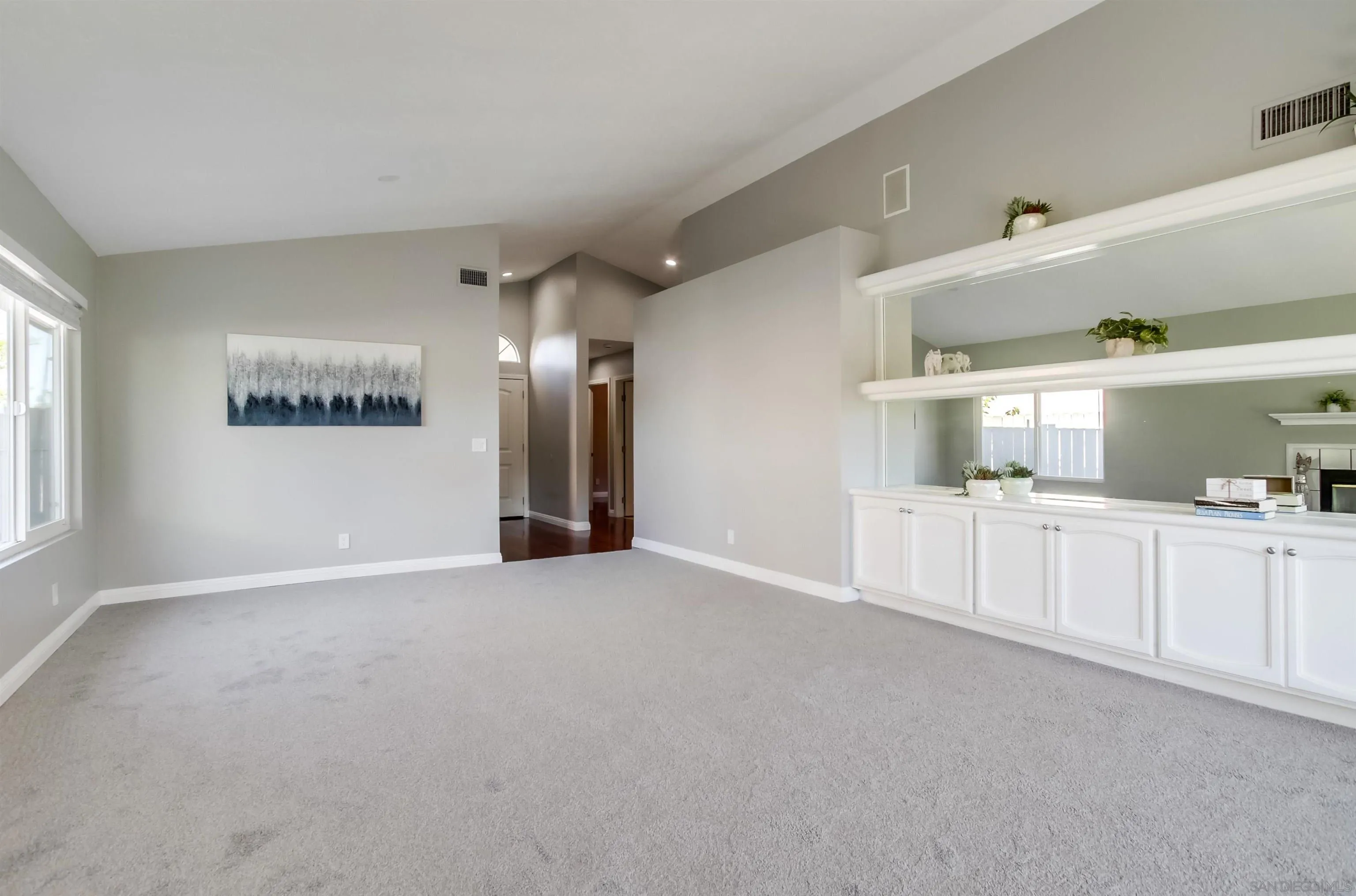 14150 Carmel Ridge Road San Diego, CA 92128 - Photo 6 of 21 a view of an empty room with window and cabinet