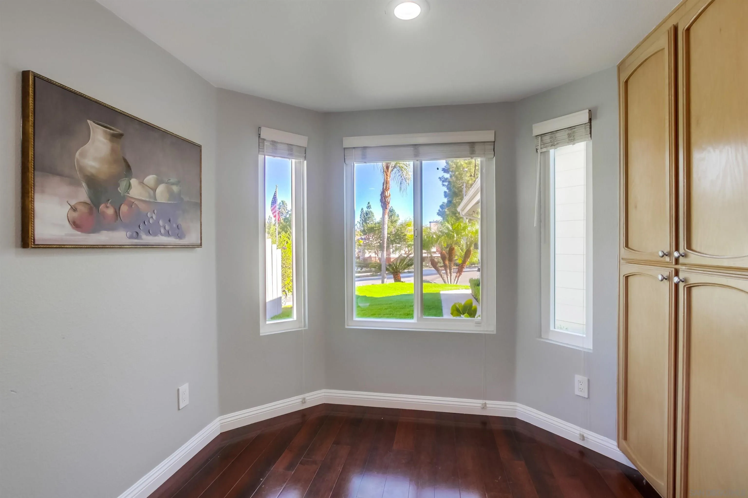 14150 Carmel Ridge Road San Diego, CA 92128 - Photo 9 of 21 wooden floor in an empty room with a window