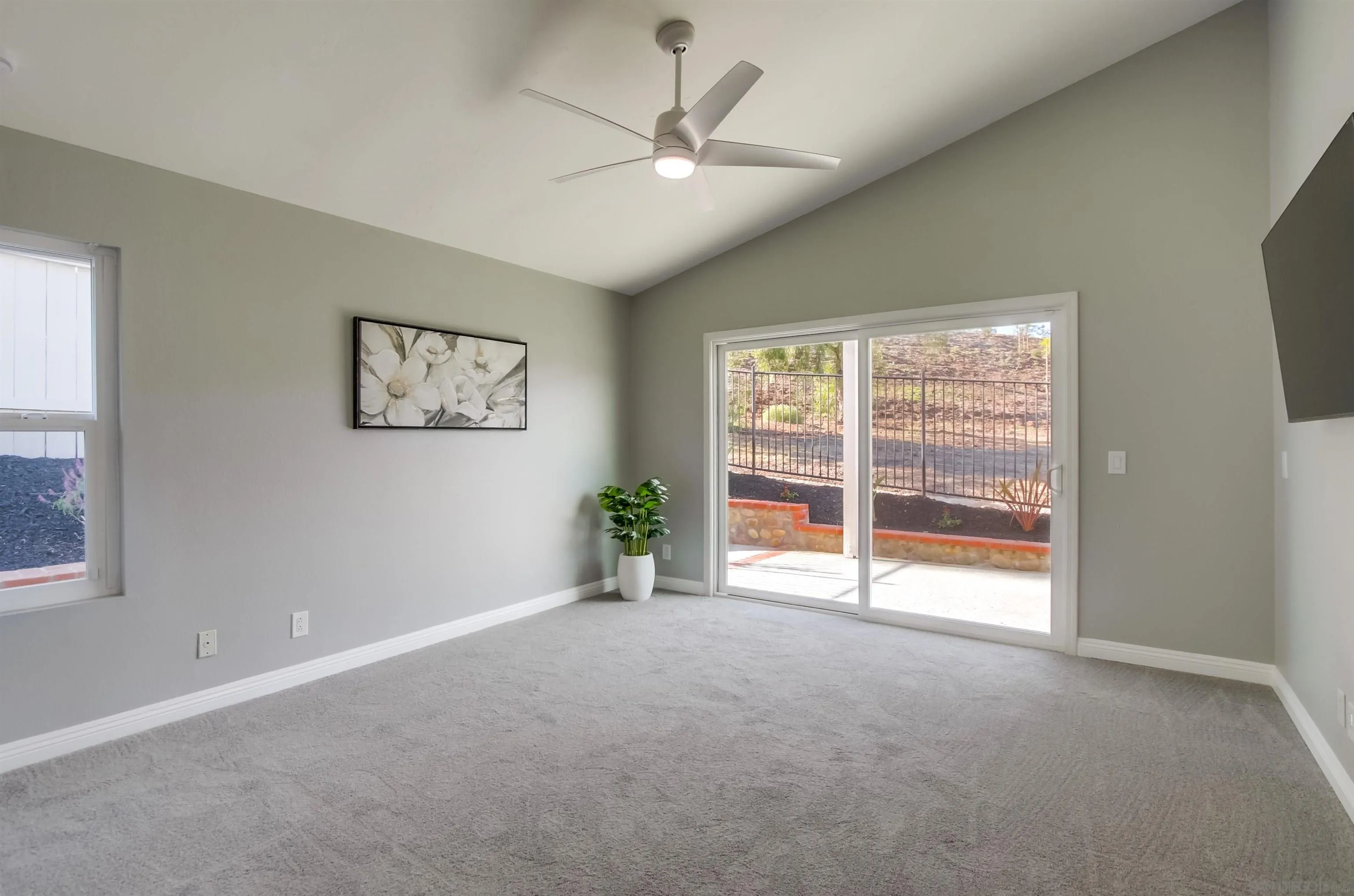 14150 Carmel Ridge Road San Diego, CA 92128 - Photo 10 of 21 a view of a livingroom with a ceiling fan and window