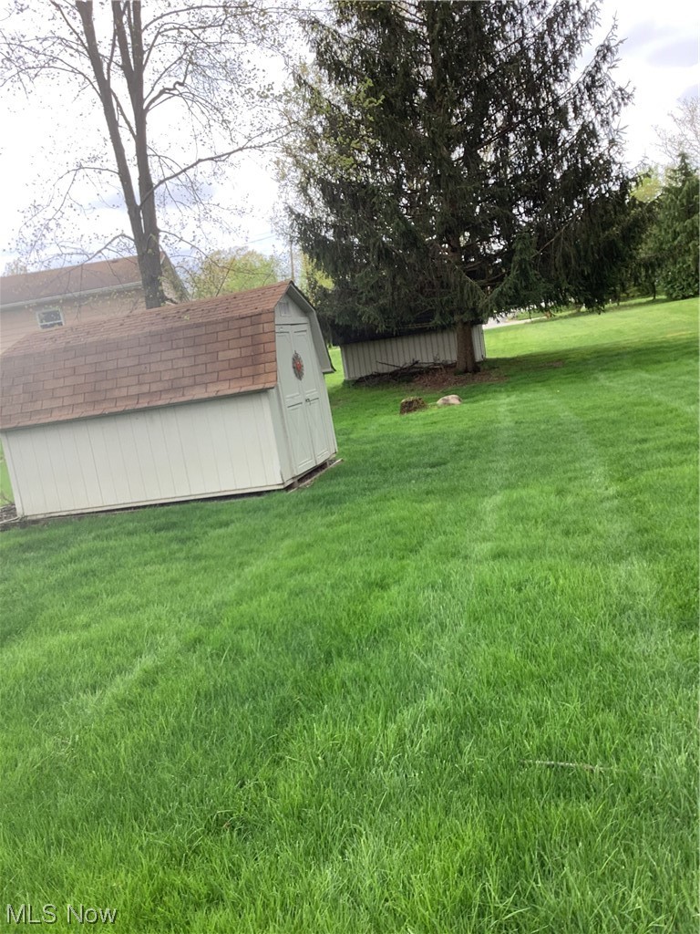 2320 South Meridian Road Austintown, OH 44511 - Photo 23 of 24 View of yard with a storage unit