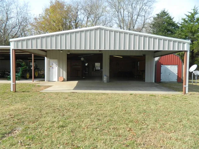 a view of a house with a backyard and porch