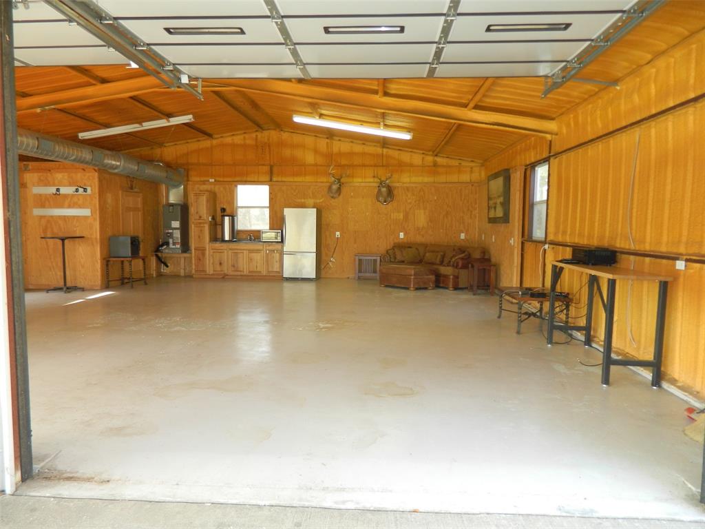956 County Road 4231 Bonham, TX 75418 - Photo 5 of 25 a view of a patio with table and chairs