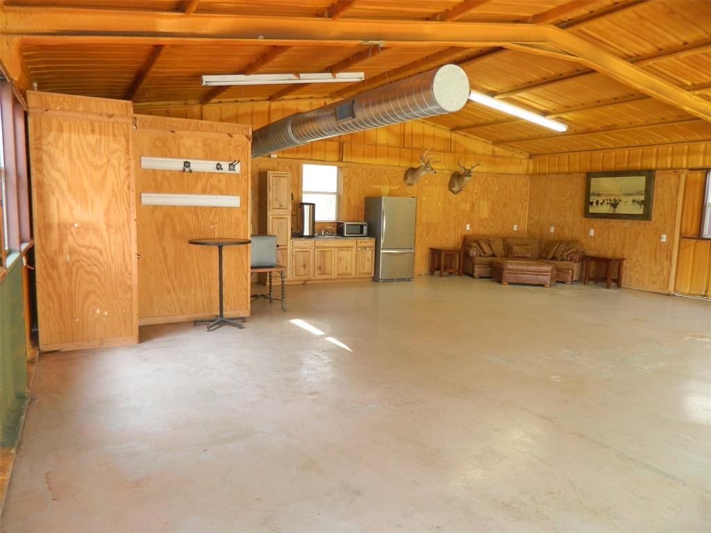 956 County Road 4231 Bonham, TX 75418 - Photo 7 of 25 a view of a livingroom with furniture and a ceiling fan
