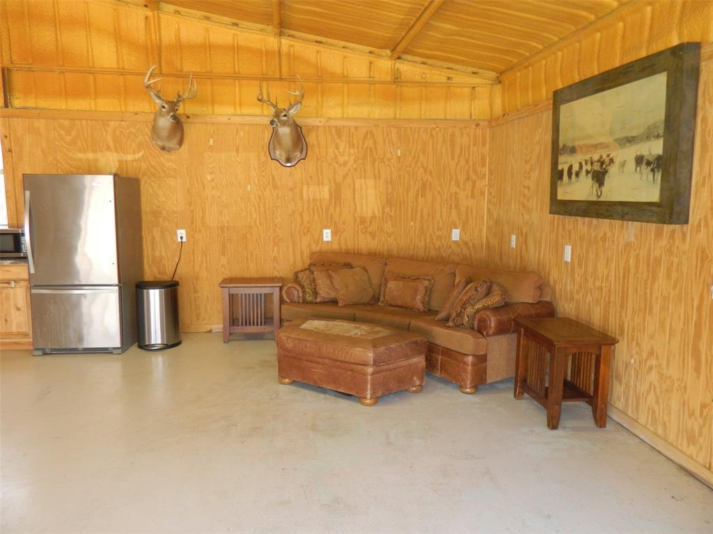956 County Road 4231 Bonham, TX 75418 - Photo 8 of 25 a living room with couches and kitchen view with wooden floor