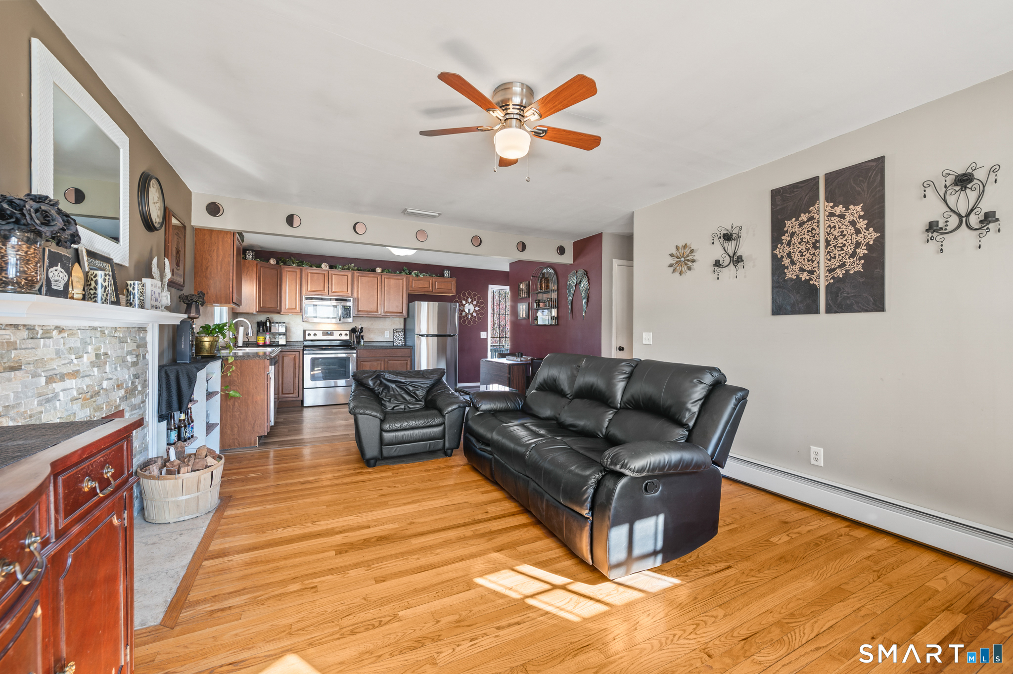 192 Wolcott Hill Road Wethersfield, CT 06109 - Photo 11 of 35 a living room with furniture and kitchen view