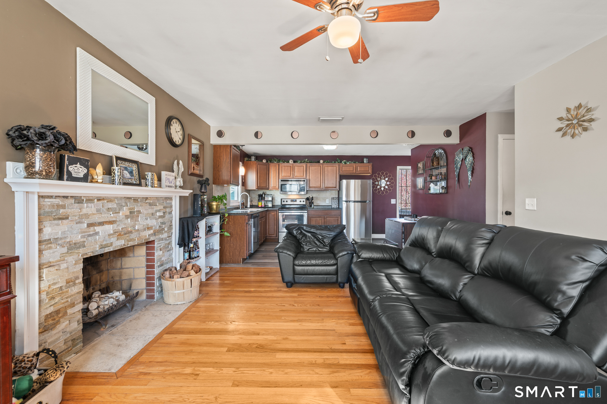 192 Wolcott Hill Road Wethersfield, CT 06109 - Photo 12 of 35 a living room with furniture and a fireplace