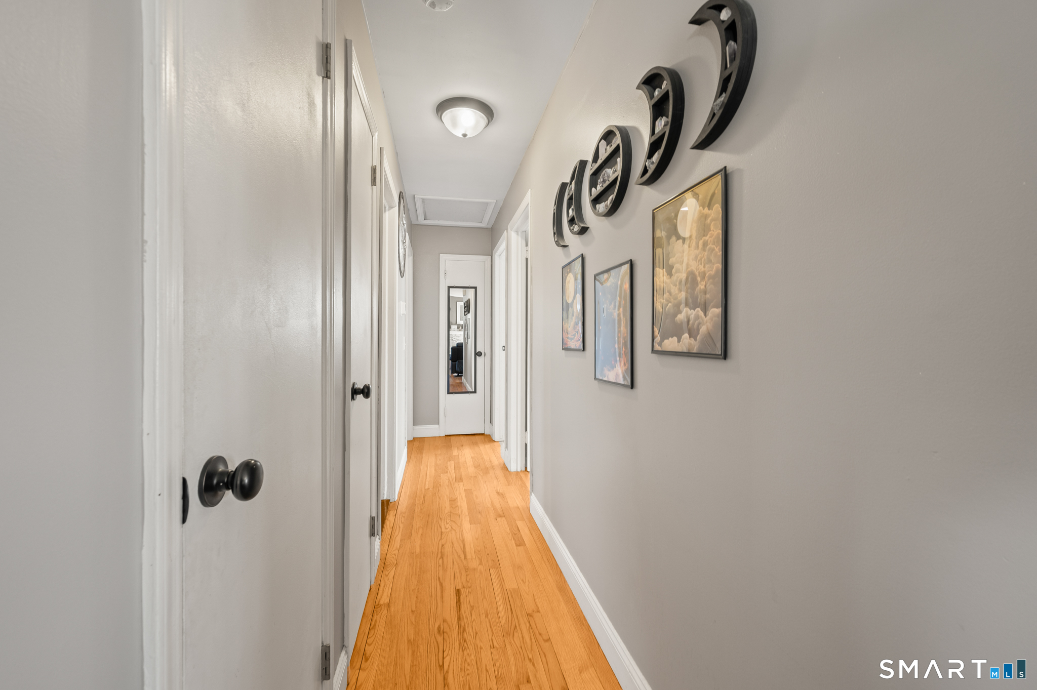192 Wolcott Hill Road Wethersfield, CT 06109 - Photo 13 of 35 a view of a hallway with wooden floor