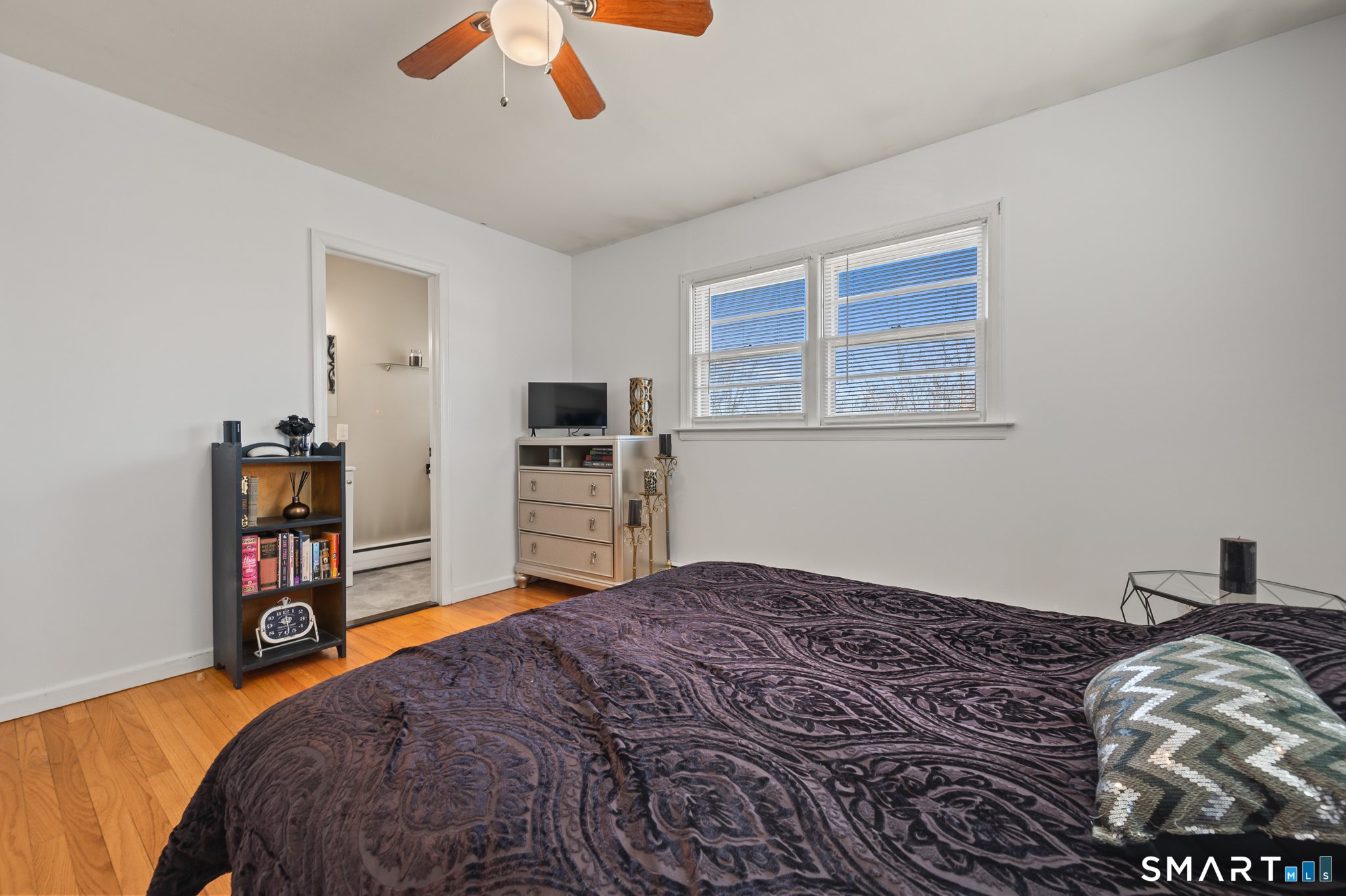 192 Wolcott Hill Road Wethersfield, CT 06109 - Photo 17 of 35 a bedroom with a bed and a television