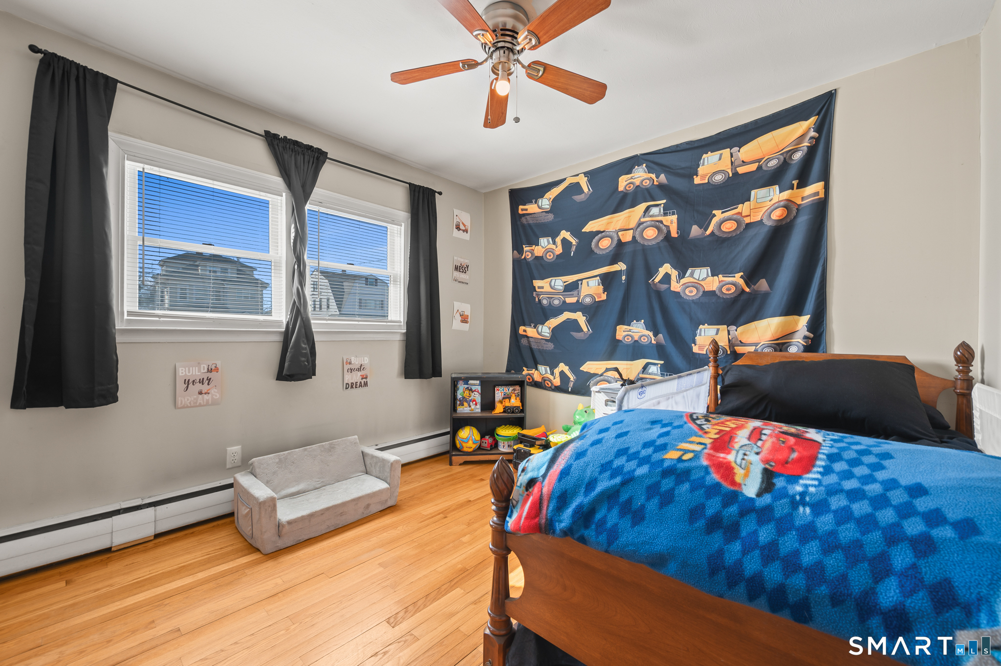 192 Wolcott Hill Road Wethersfield, CT 06109 - Photo 19 of 35 a bed room with a bed and a couch